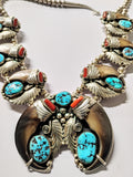 Native American Navajo crafted bear claw necklace with turquoise and red coral.